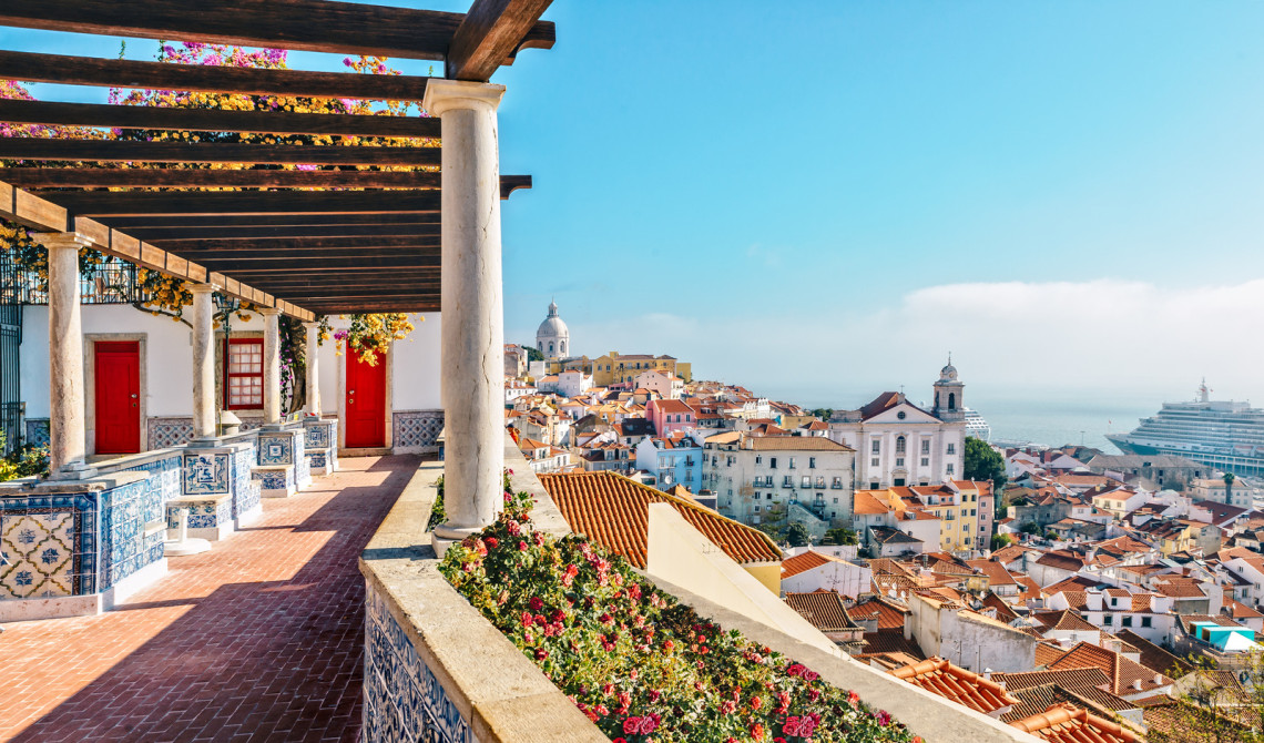 a lookout amongst a variety of buildings of different colors and shapes in Lisbon